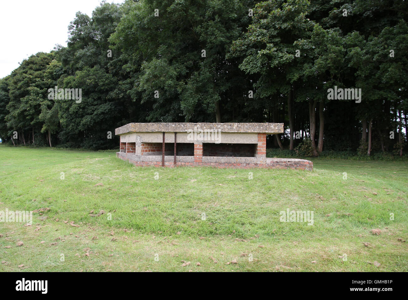 An old disused sunken anti invasion / tank second world war airfield defence pillbox located in Gloucestershire on a former RAF airfield at Kemble Stock Photo