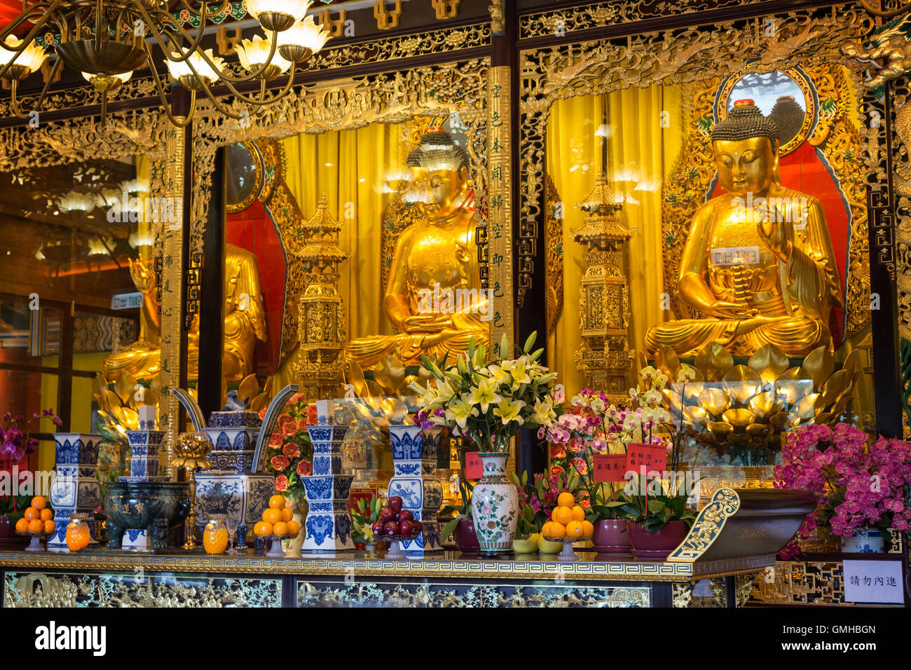 Buddha statues and altar at the Main Shrine Hall of Buddha at the Po