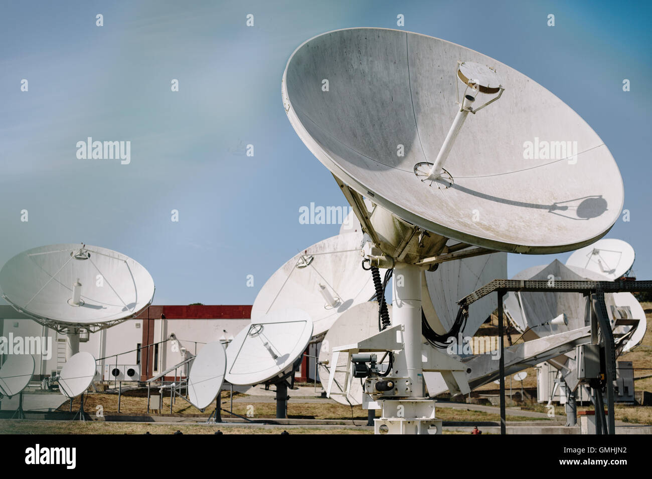 Array of satellite dishes for telecommunications Stock Photo