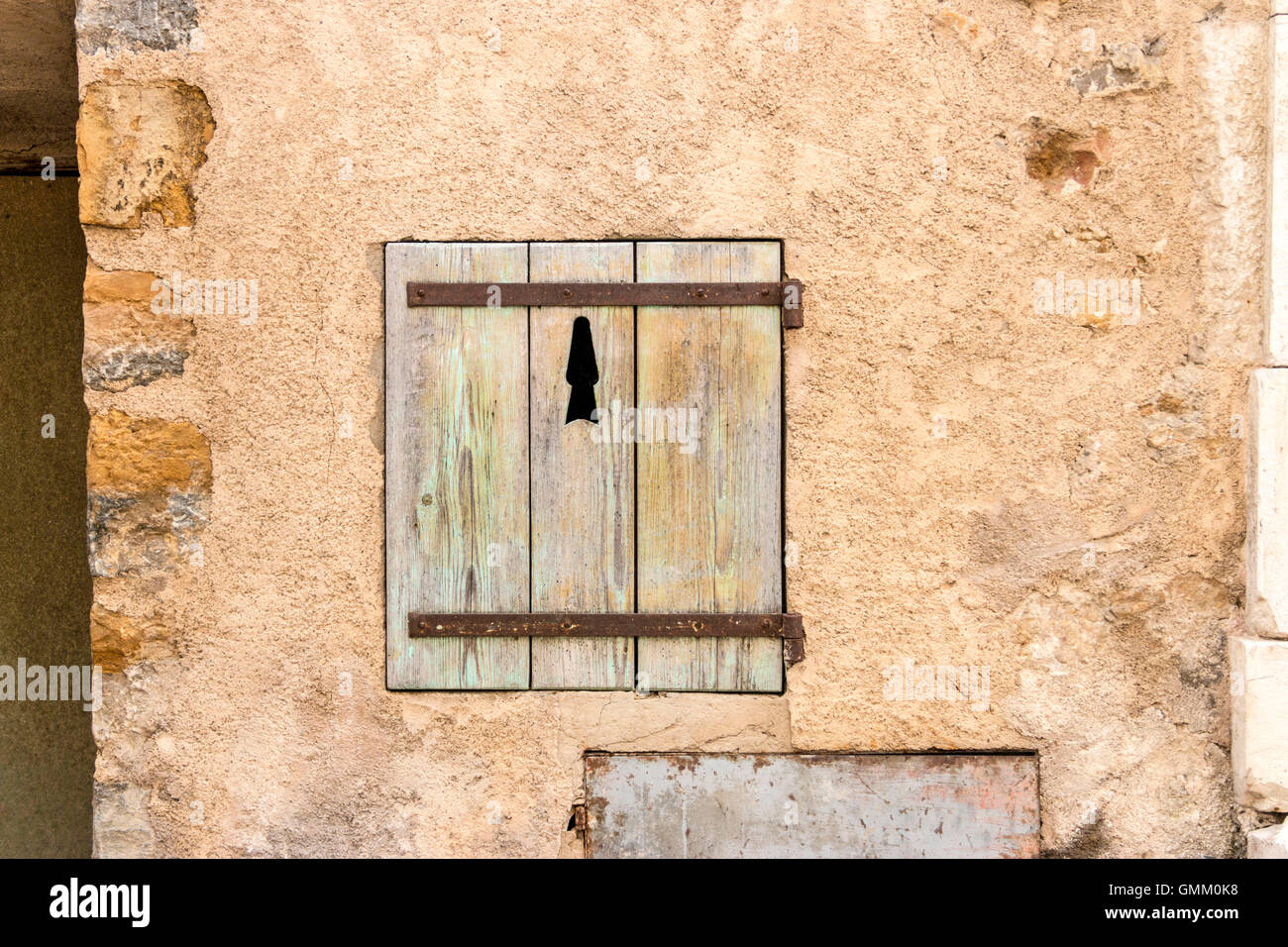 Rustic weathered shutters on old French buildings Stock Photo - Alamy