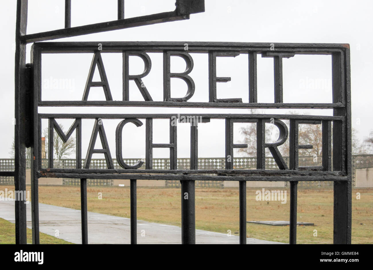 Inscription ARBEIT MACHT FREI on the gates to the former Nazi concentration camp, now the Sachsenhausen National Memorial in Ora Stock Photo