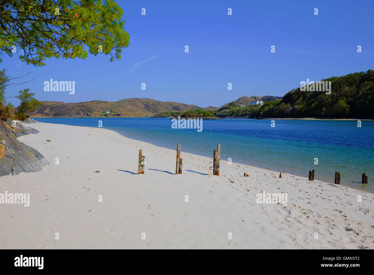 White Sand beach in the uk at Morar Scotland with clear blue sea