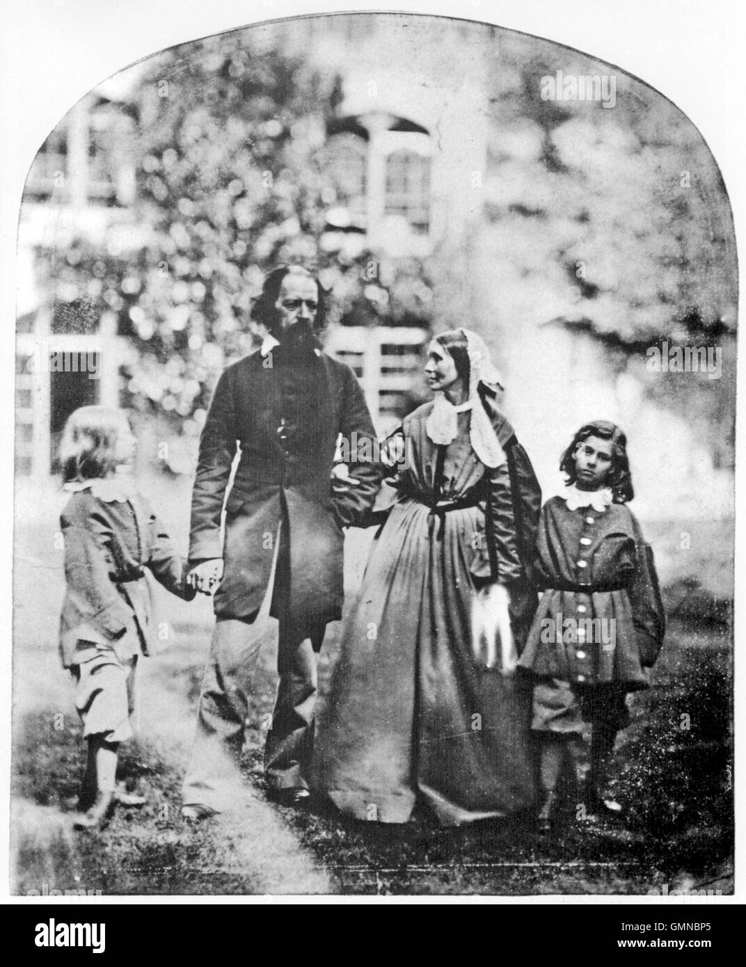 ALFRED TENNYSON (1809-1892) English poet with his family at their home Farringford House in Freshwater Bay on the Isle of Wight in 1862. From left: Lionel, Tennyson, wife Emily, Hallam. Photo Oscar Rejlander Stock Photo