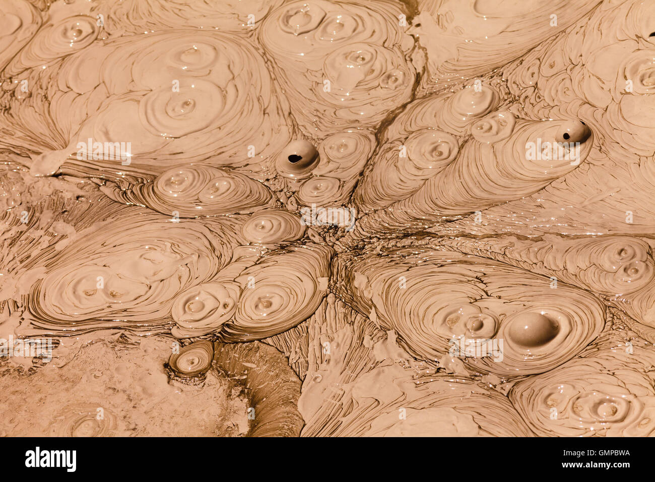 Bubbling hot mud geothermal sping background Stock Photo Alamy