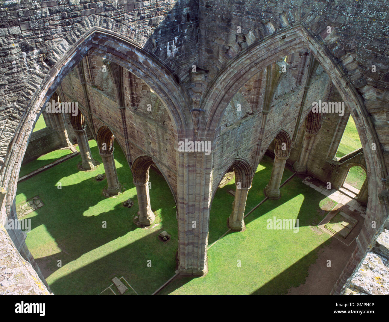Looking down into the crossing of Tintern Abbey church, Monmouthshire, with the chancel & south aisle (L), the south transept & S entrance (R). Stock Photo