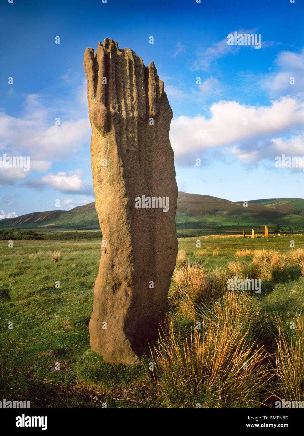 Machrie Moor stone circles, Isle of Arran: a tall sandstone pillar of Circle III with the stones of Circle II visible to rear (R). Stock Photo