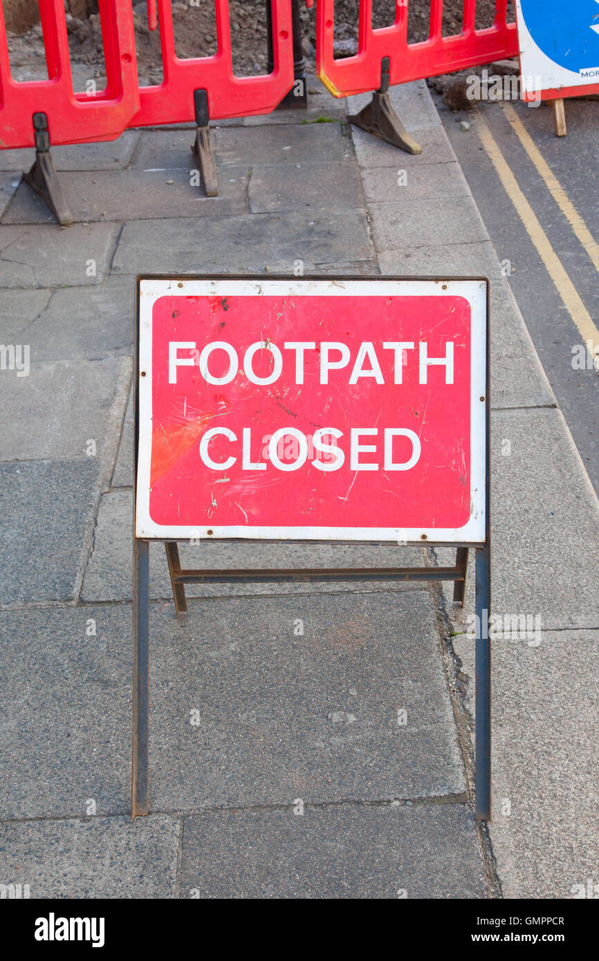 Sidewalk closed sign road barricade hi-res stock photography