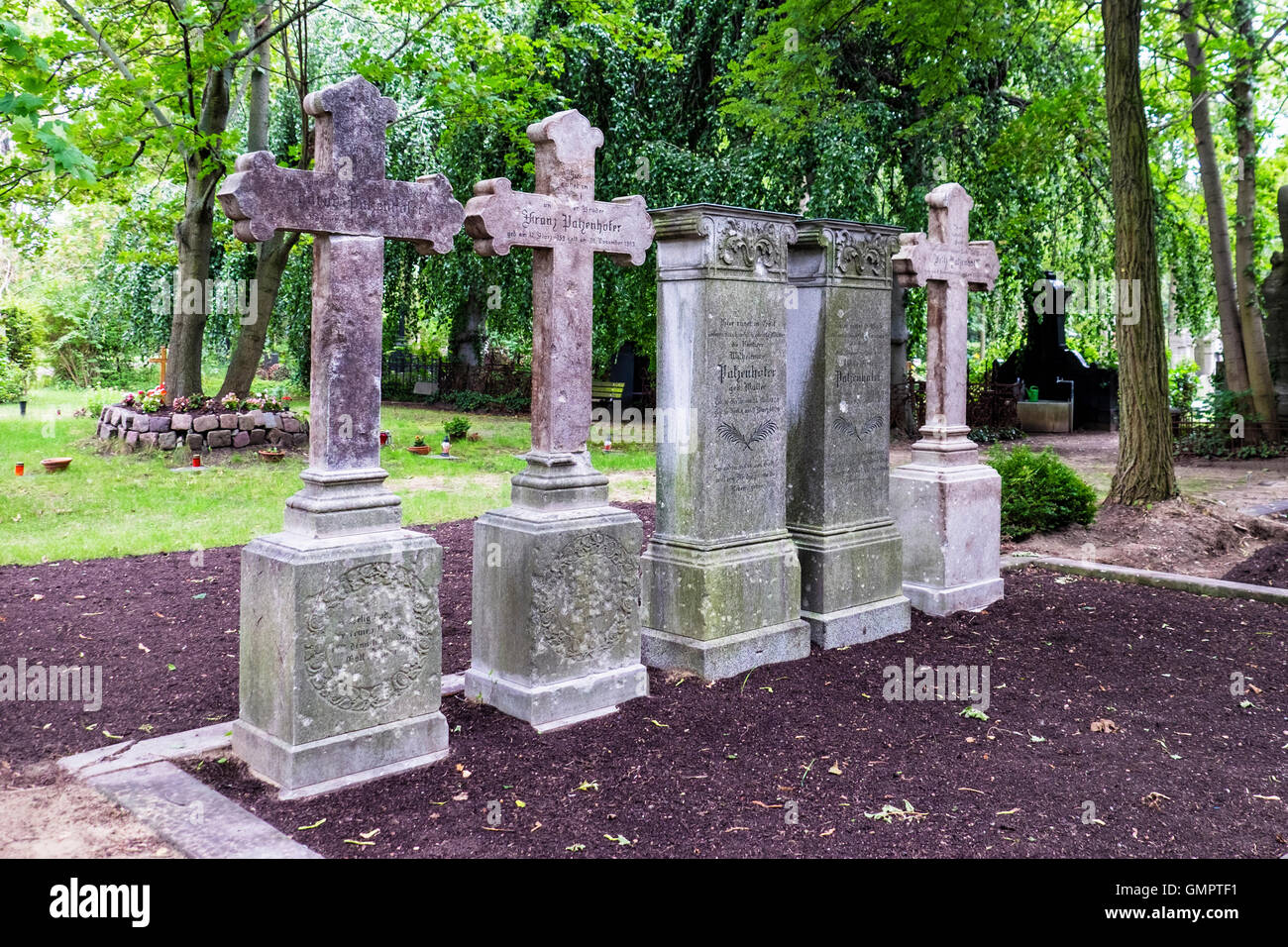Old stone grave stones, graves and crosses at St. Hedwig Cemetery, Alter Domfriedhof St. Hedwig, Berlin. Stock Photo