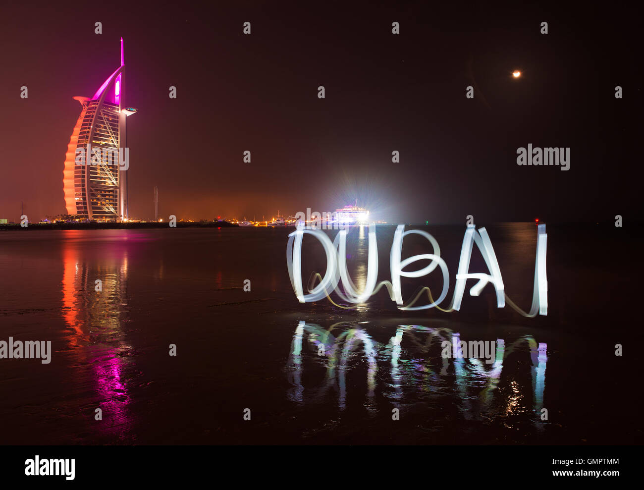 DUBAI, UAE - MARCH 5 :Light show on the beach near hotel Burj Al Arab, March 5, 2014 in Dubai, United Arab Emirates Stock Photo
