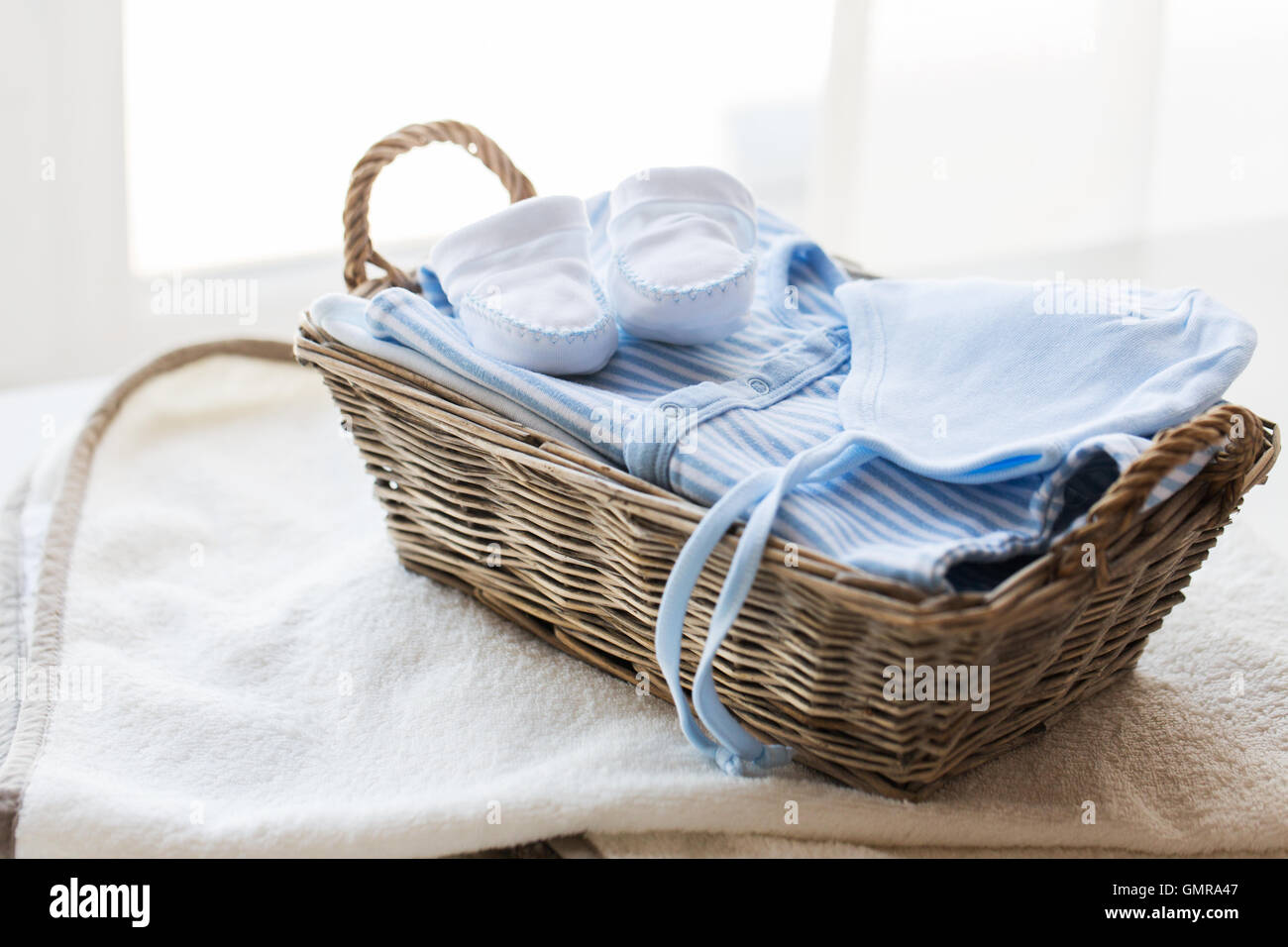 close up of baby clothes for newborn boy in basket Stock Photo - Alamy