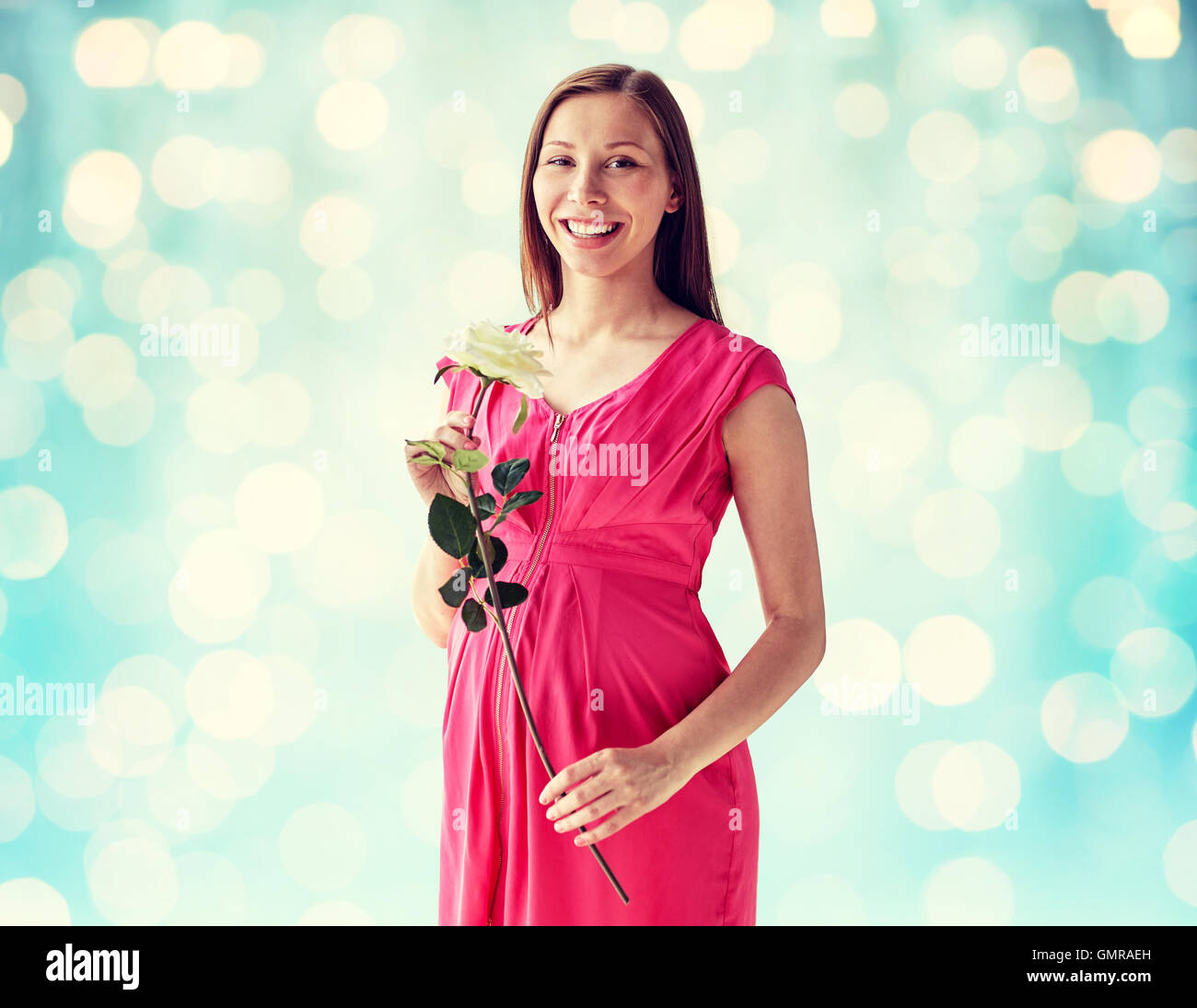 happy pregnant woman with rose flower Stock Photo Alamy