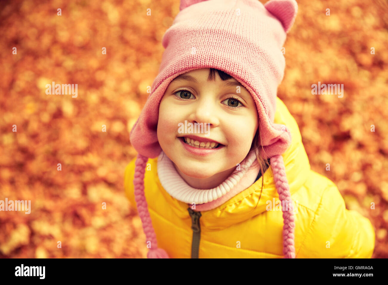 happy little girl in autumn park Stock Photo - Alamy