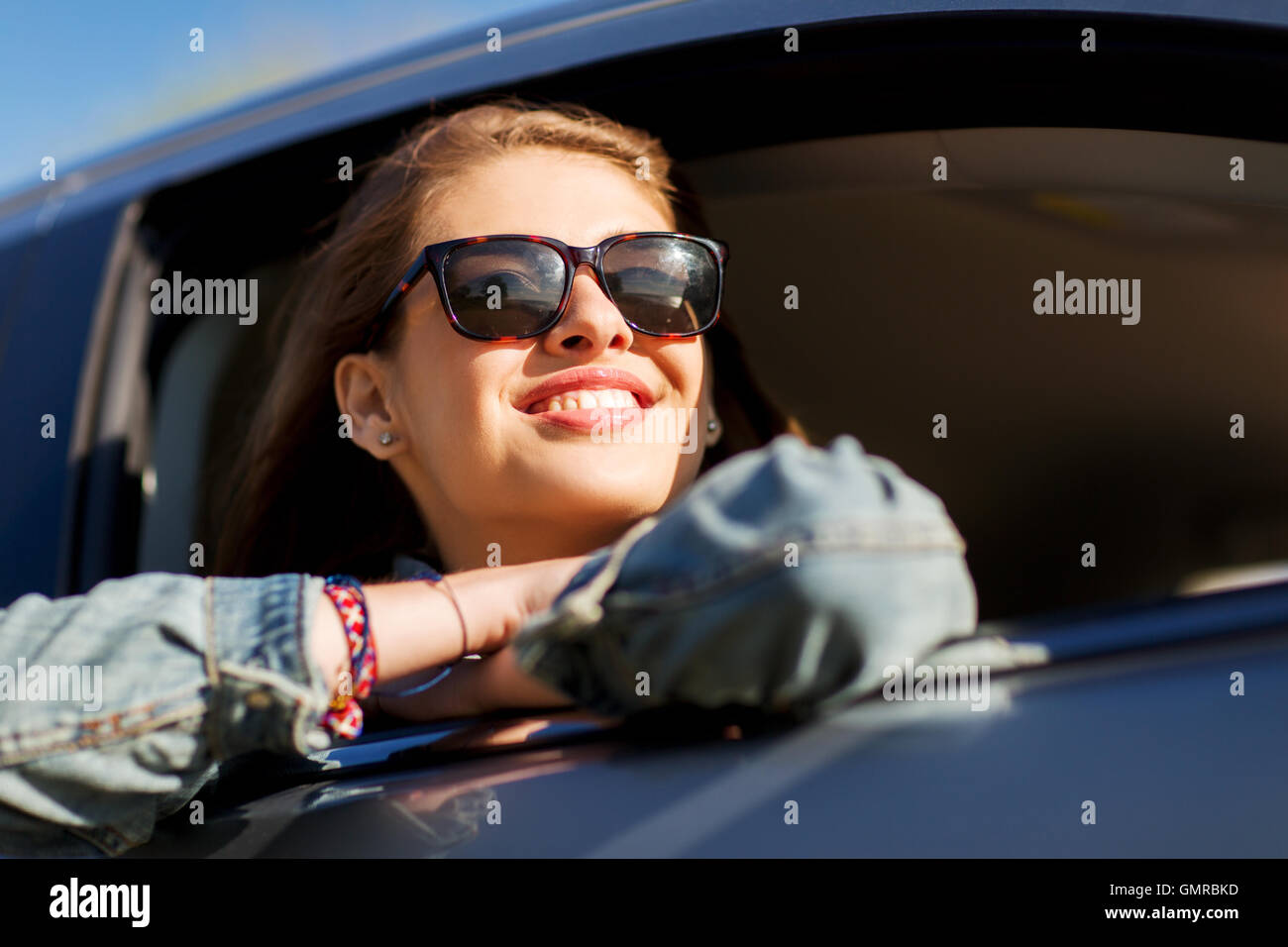 happy teenage girl or young woman in car Stock Photo - Alamy