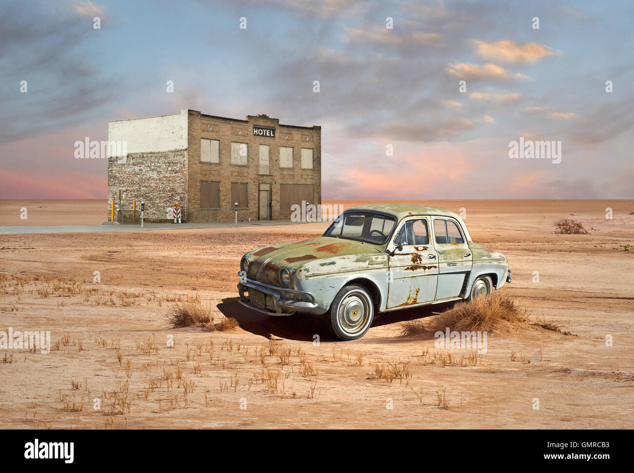 Retro Style Scene of vintage car and hotel in desert Stock Photo