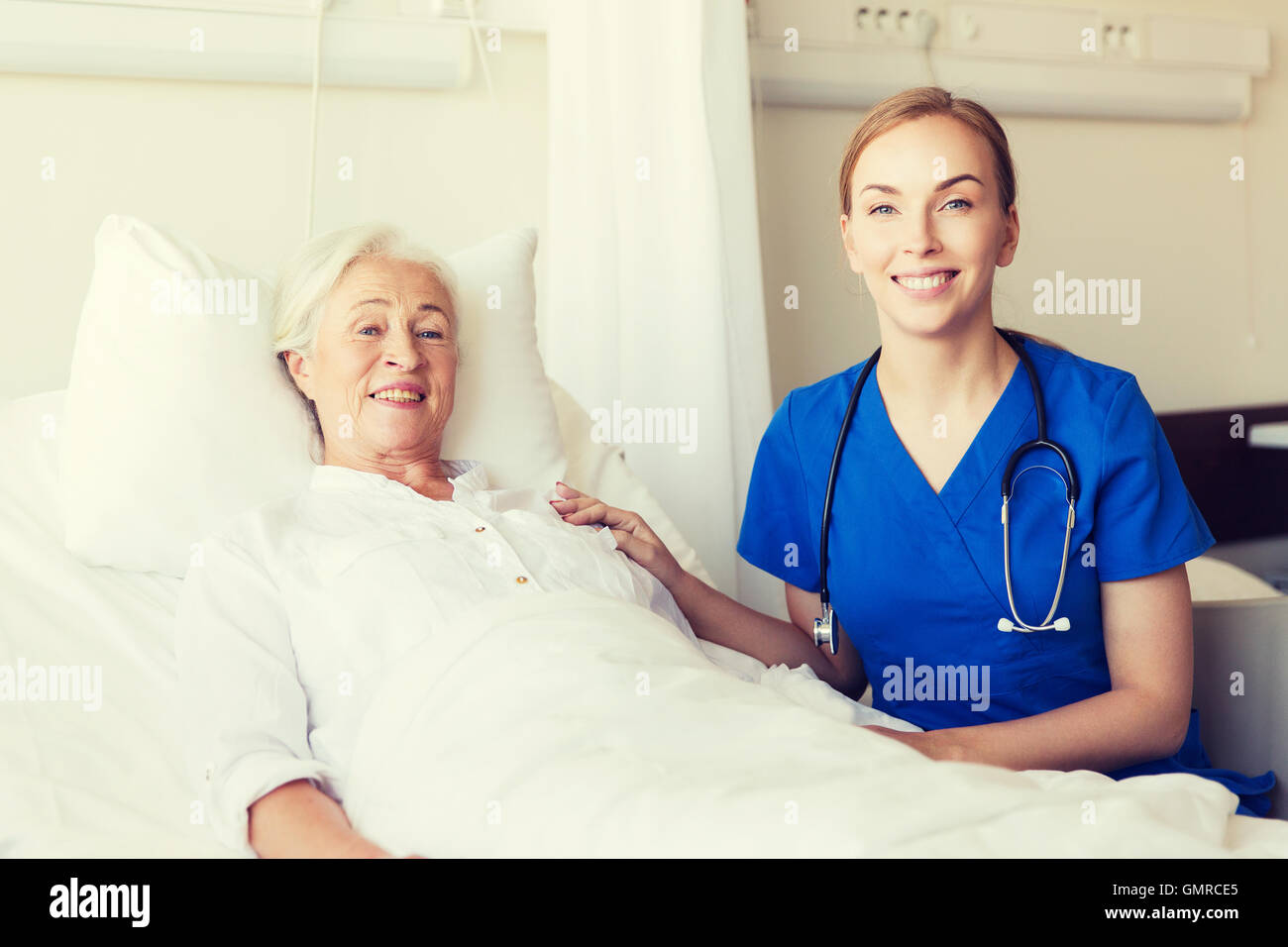 doctor or nurse visiting senior woman at hospital Stock Photo - Alamy