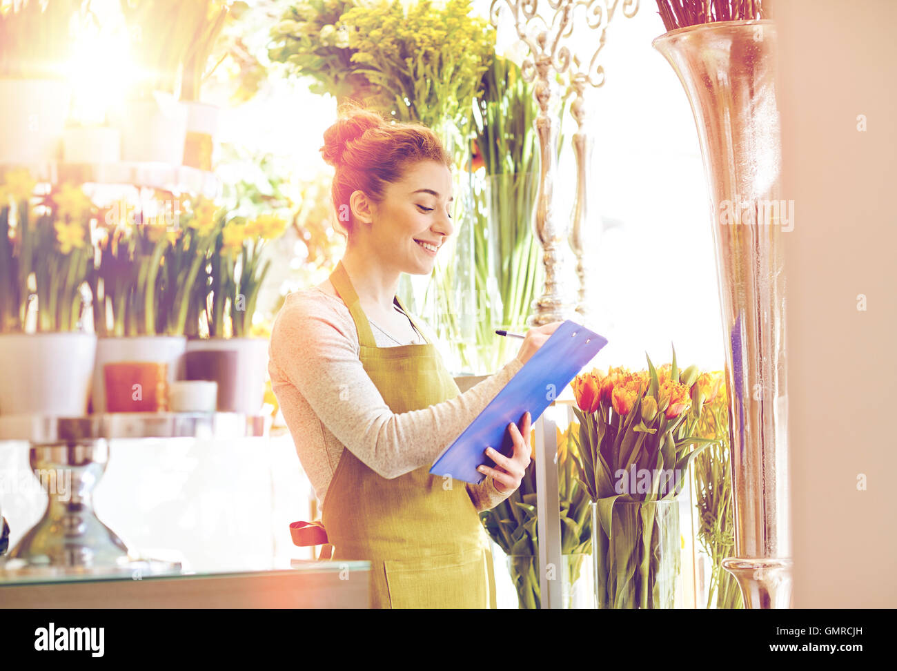 florist woman with clipboard at flower shop Stock Photo - Alamy