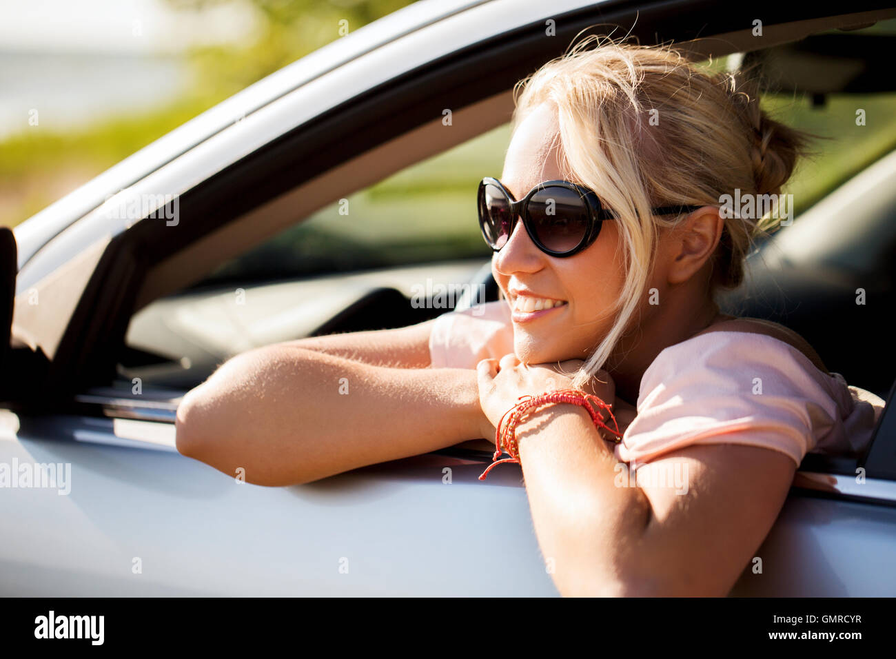 happy teenage girl or young woman in car Stock Photo - Alamy