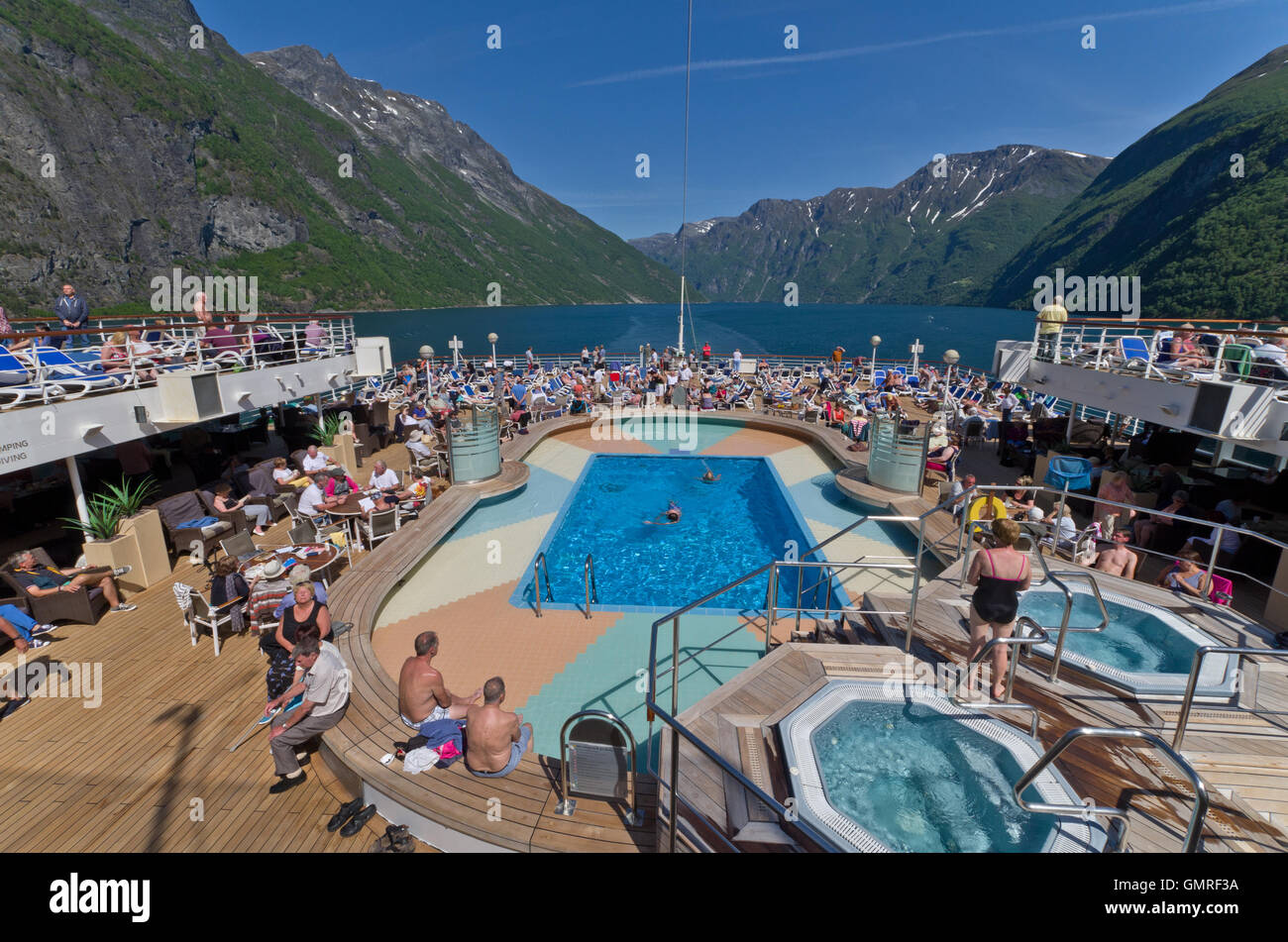 Holiday makers thronging the deck of the P&O ship Arcadia on a cruise to the Norweigian Fjords. Stock Photo