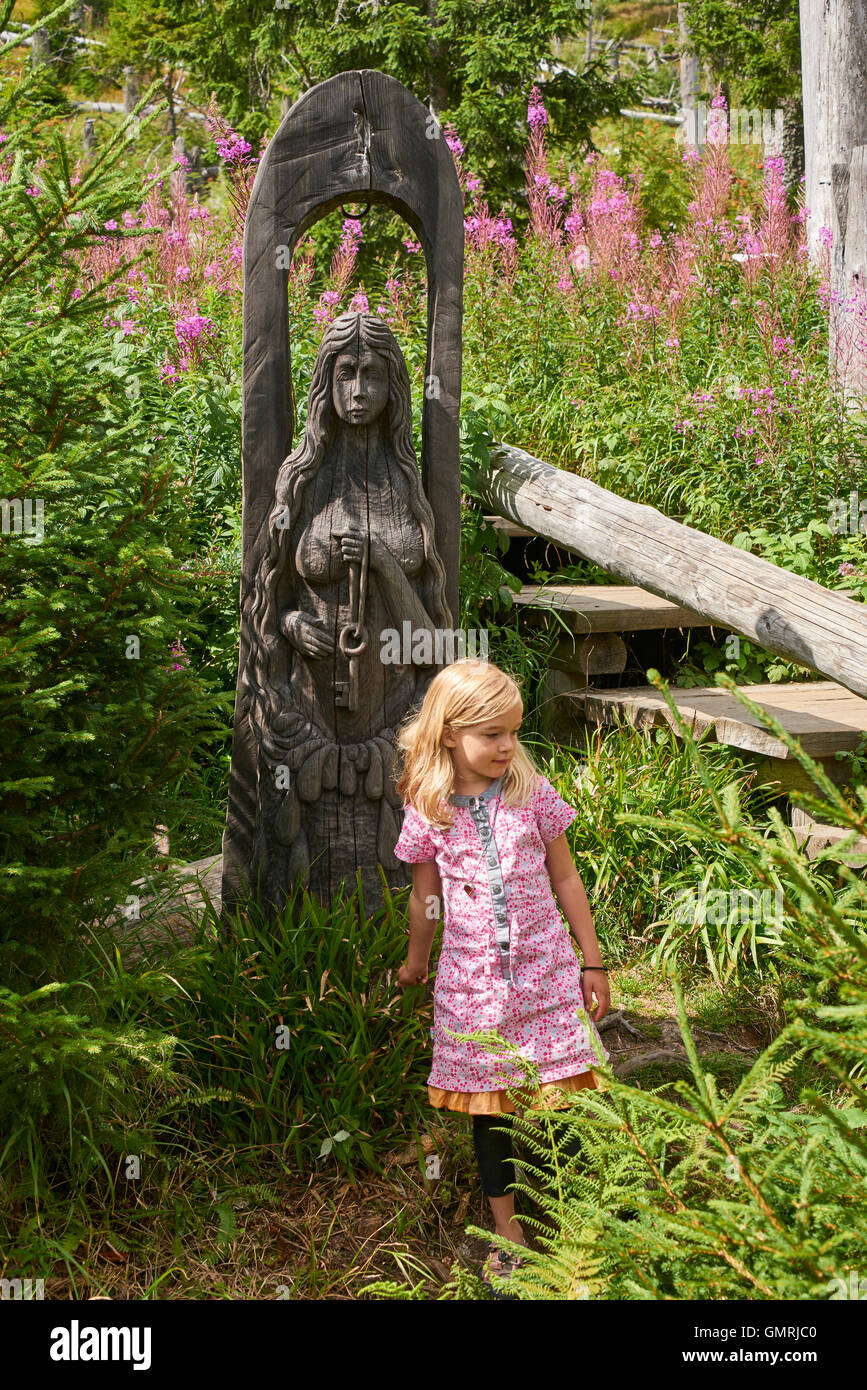 Child blond girl appearing around Spring of Vltava, Sumava National Park, Czech Republic Stock Photo