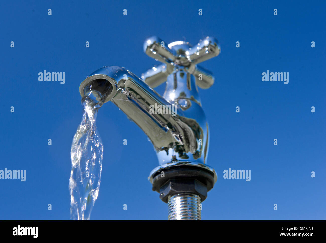 Fresh drinking water dripping and pouring from a tap Stock Photo Alamy