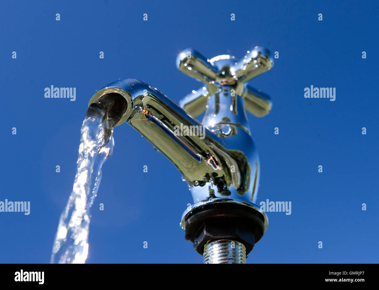Fresh drinking water dripping and pouring from a tap Stock Photo Alamy