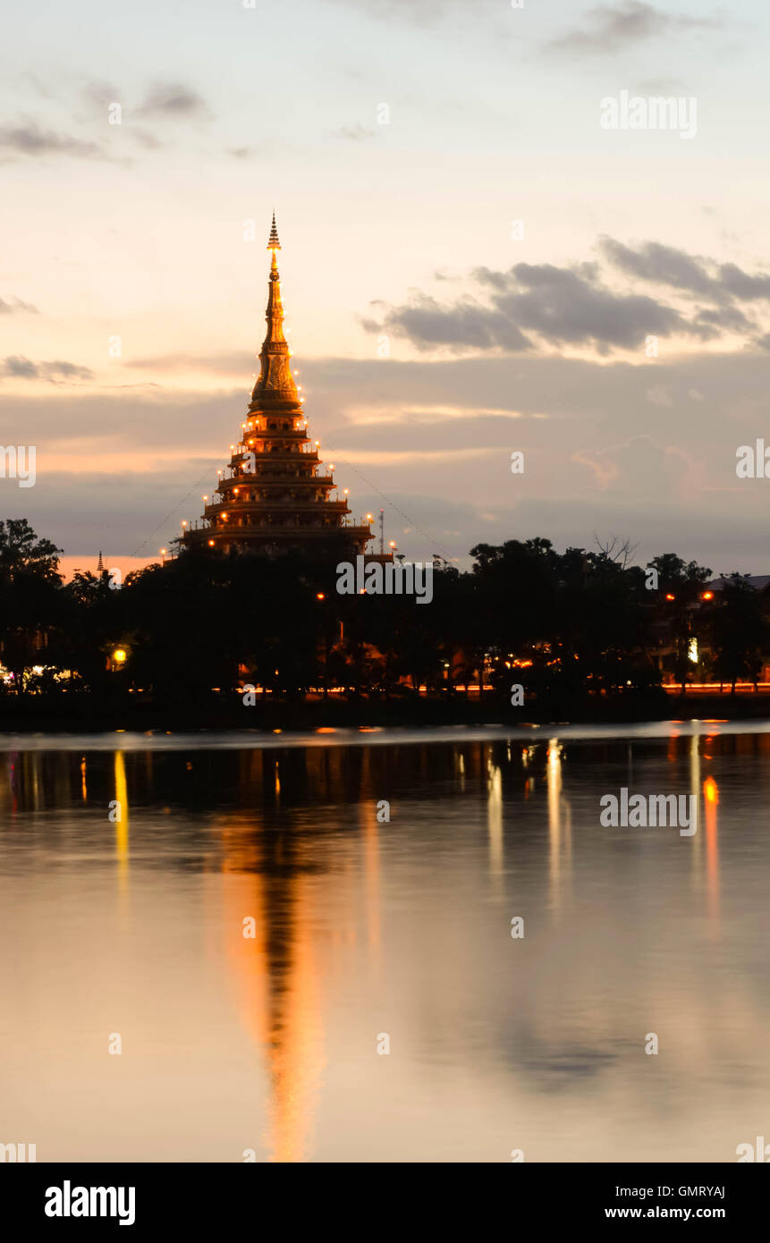 Sunset stupa thailand Culture religion lifestyle marsh water silhouette Cloud tree light Stock Photo
