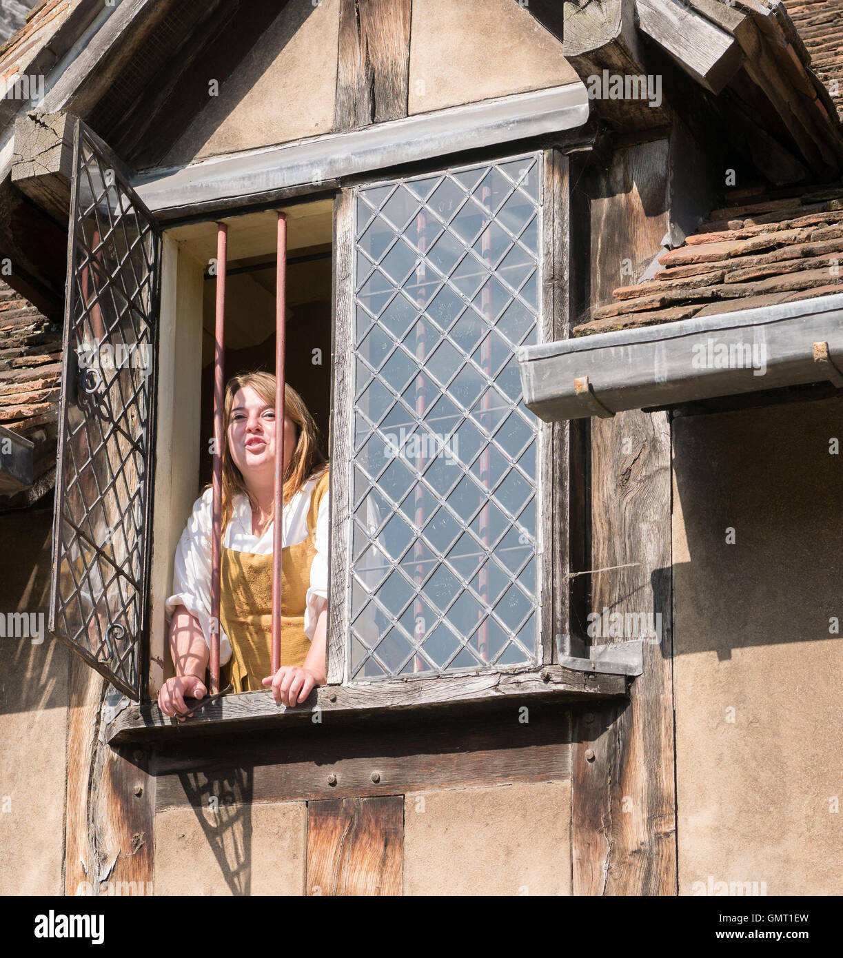 Actor plays the part of Juliet at a window of the house where William Shakespeare was born and lived until he left home. Stock Photo