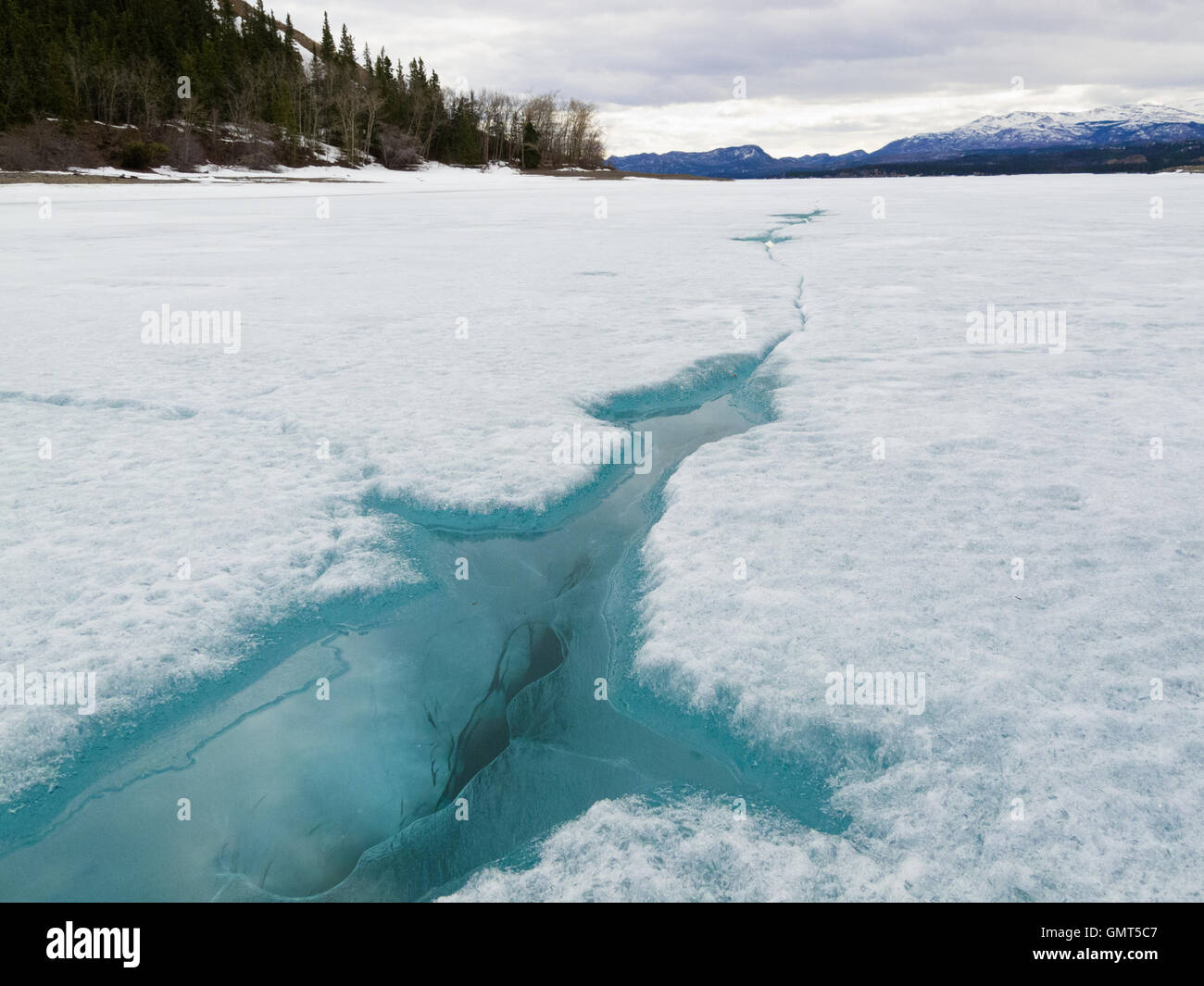 Cracked ice of frozen Lake Laberge Yukon Canada Stock Photo