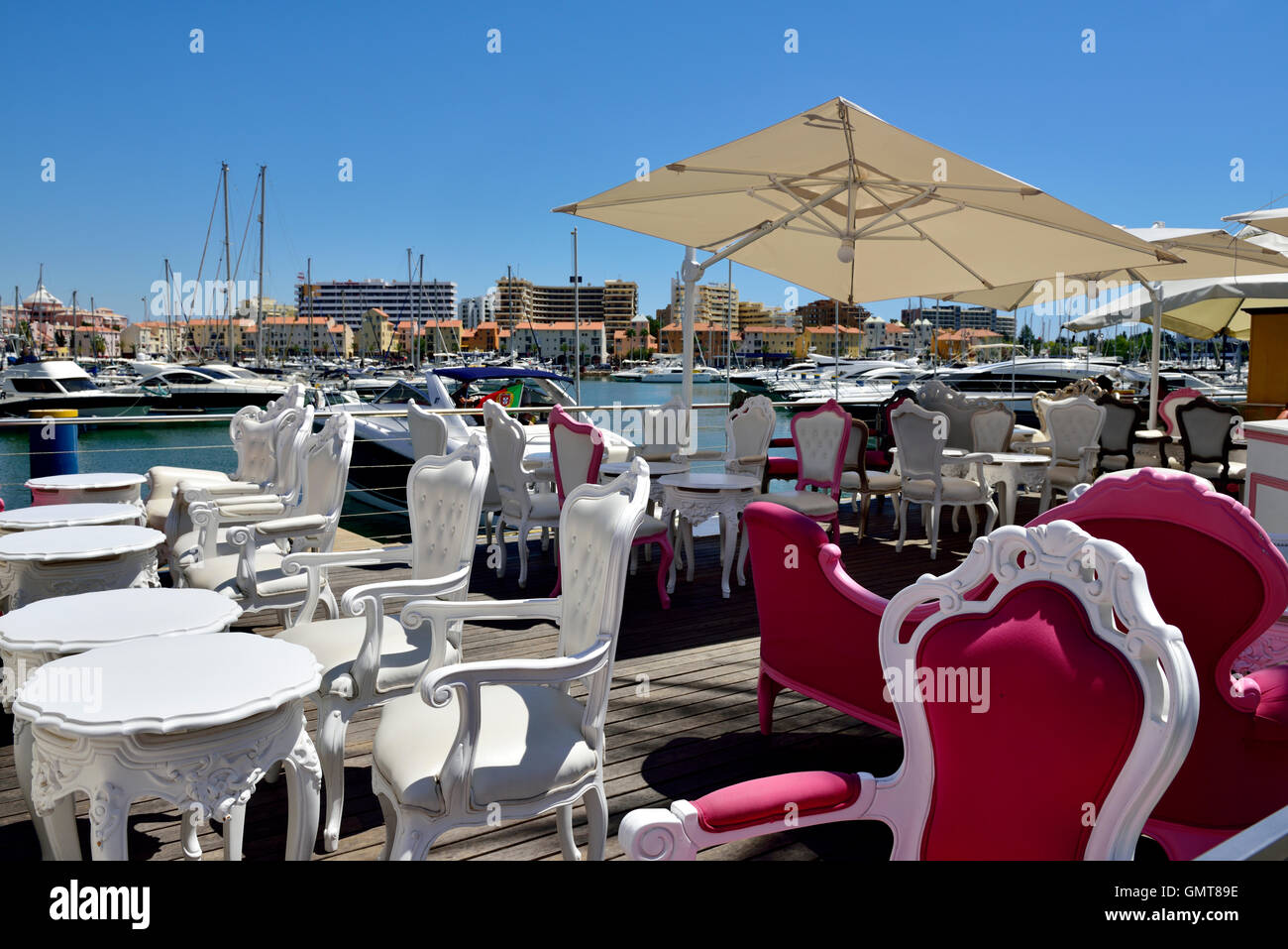 Restaurant along the quayside in Vilamoura harbour, near Quarteira and Faro Algarve, south Portugal Stock Photo