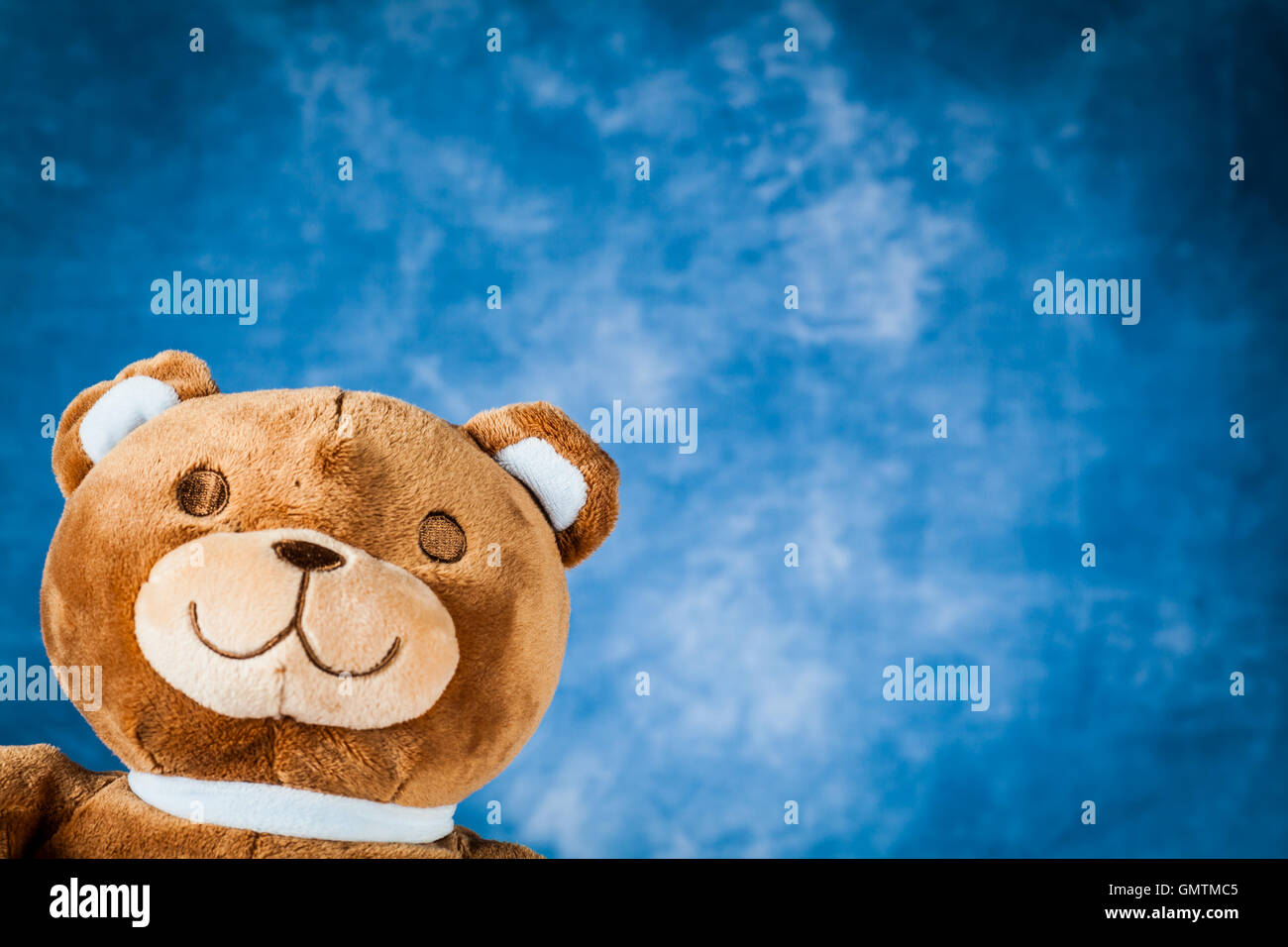 Teddy Bear toy on blue sky background with copyspace Stock Photo - Alamy
