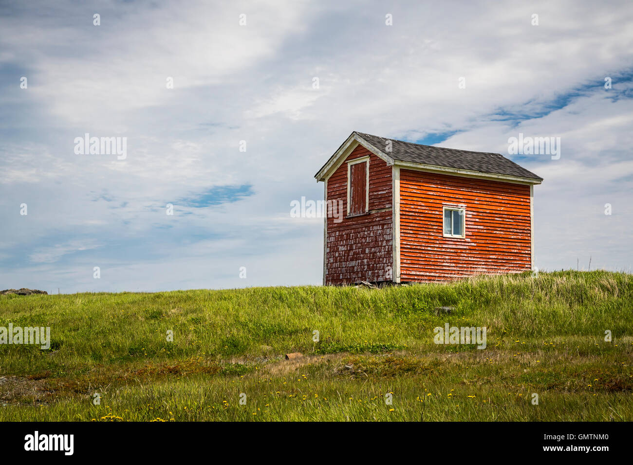 A lone red fishing stage near Elliston, Newfoundland and Labrador, Canada. Stock Photo