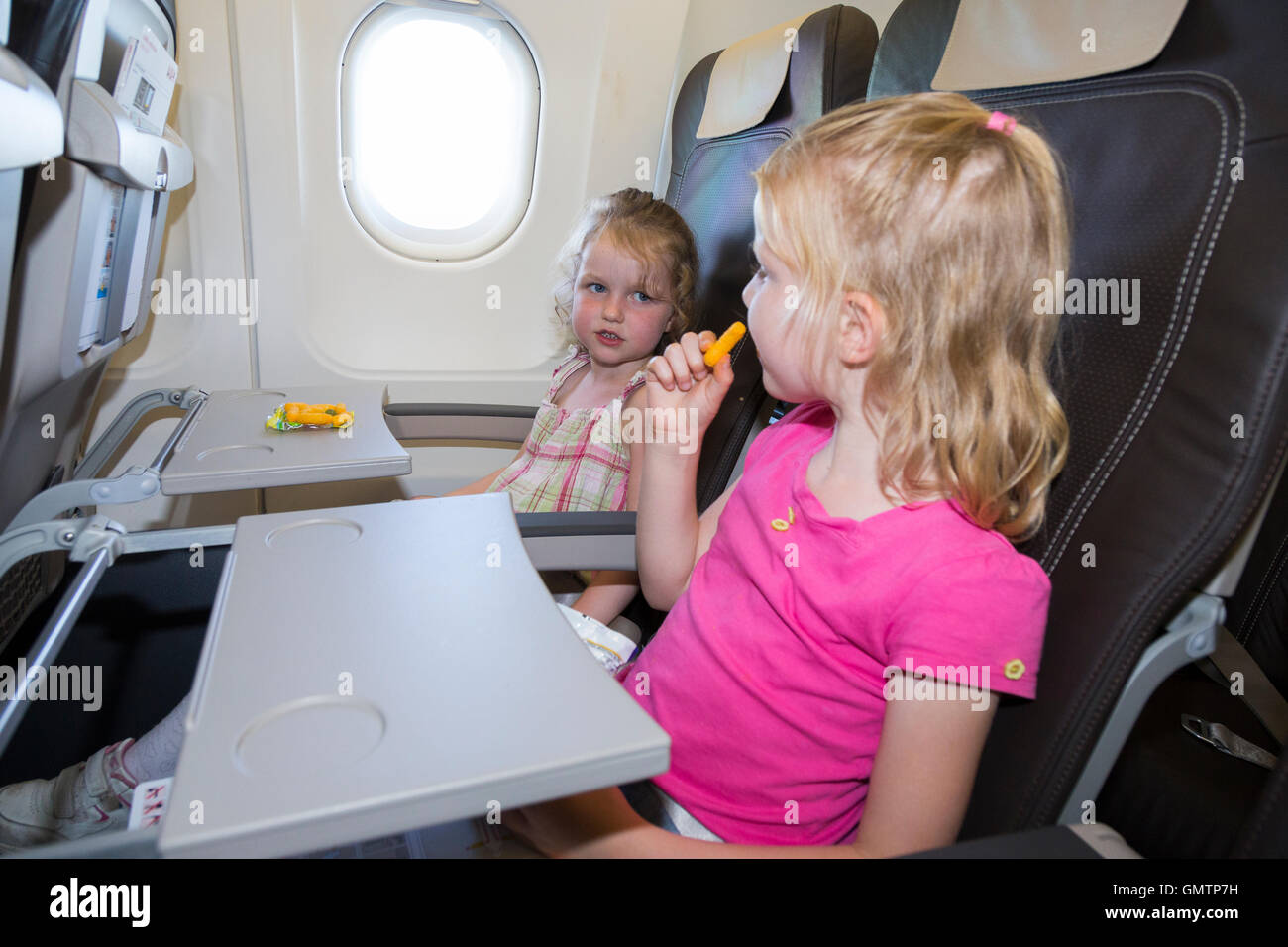Plane passenger eating hires stock photography and images Alamy