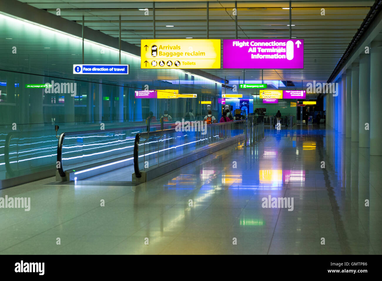Heathrow Airport corridor / hall leading to arrivals after alighting from airplane & entering airport terminal 2. LHR London UK Stock Photo