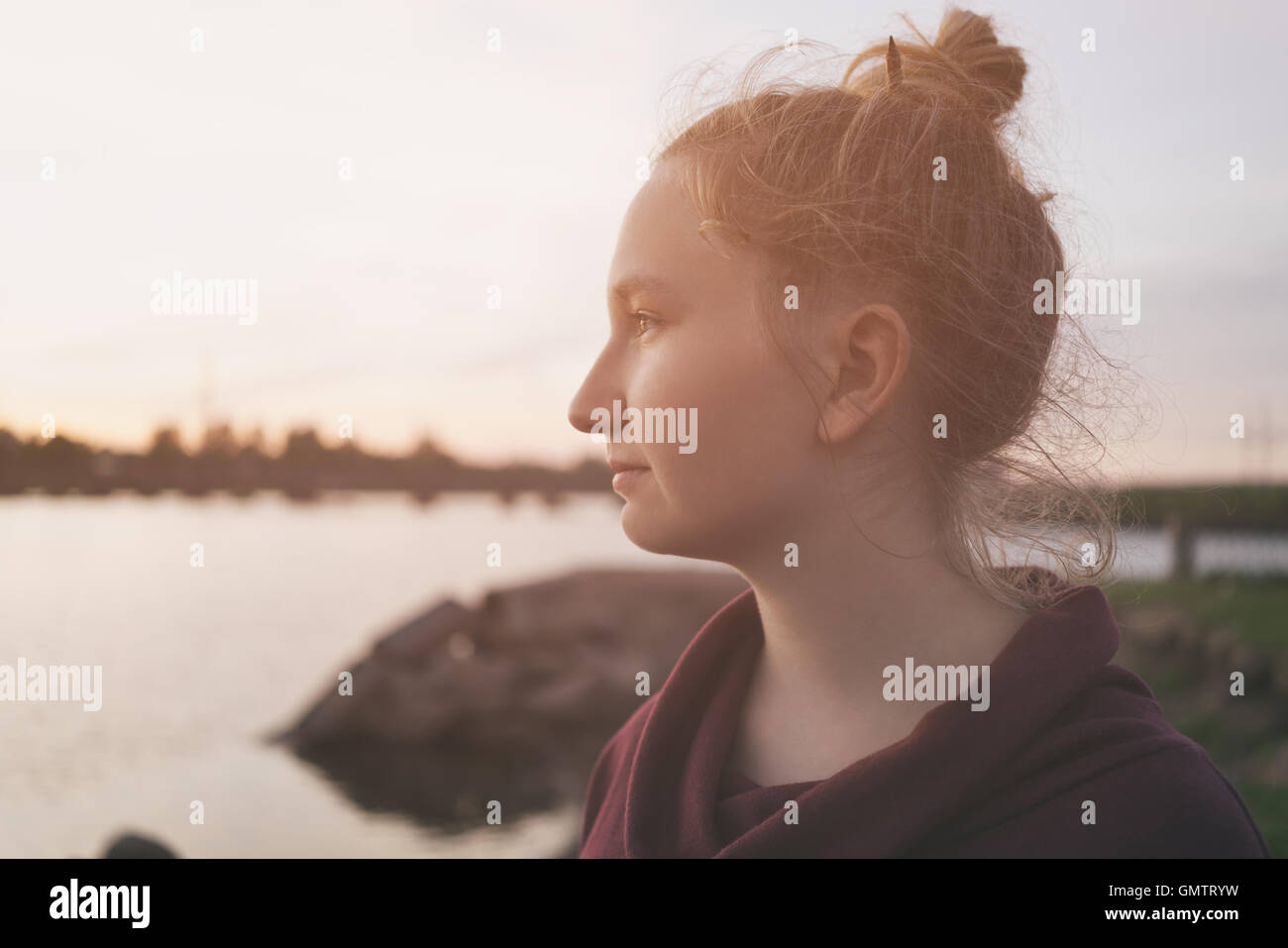 portrait of teenage girl on embankment in sunset Stock Photo - Alamy