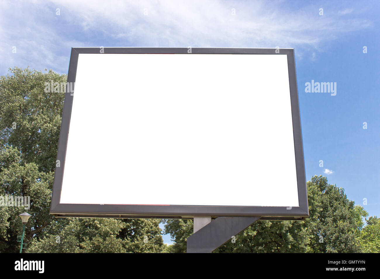 Blank billboard in a park with blue sky Stock Photo - Alamy