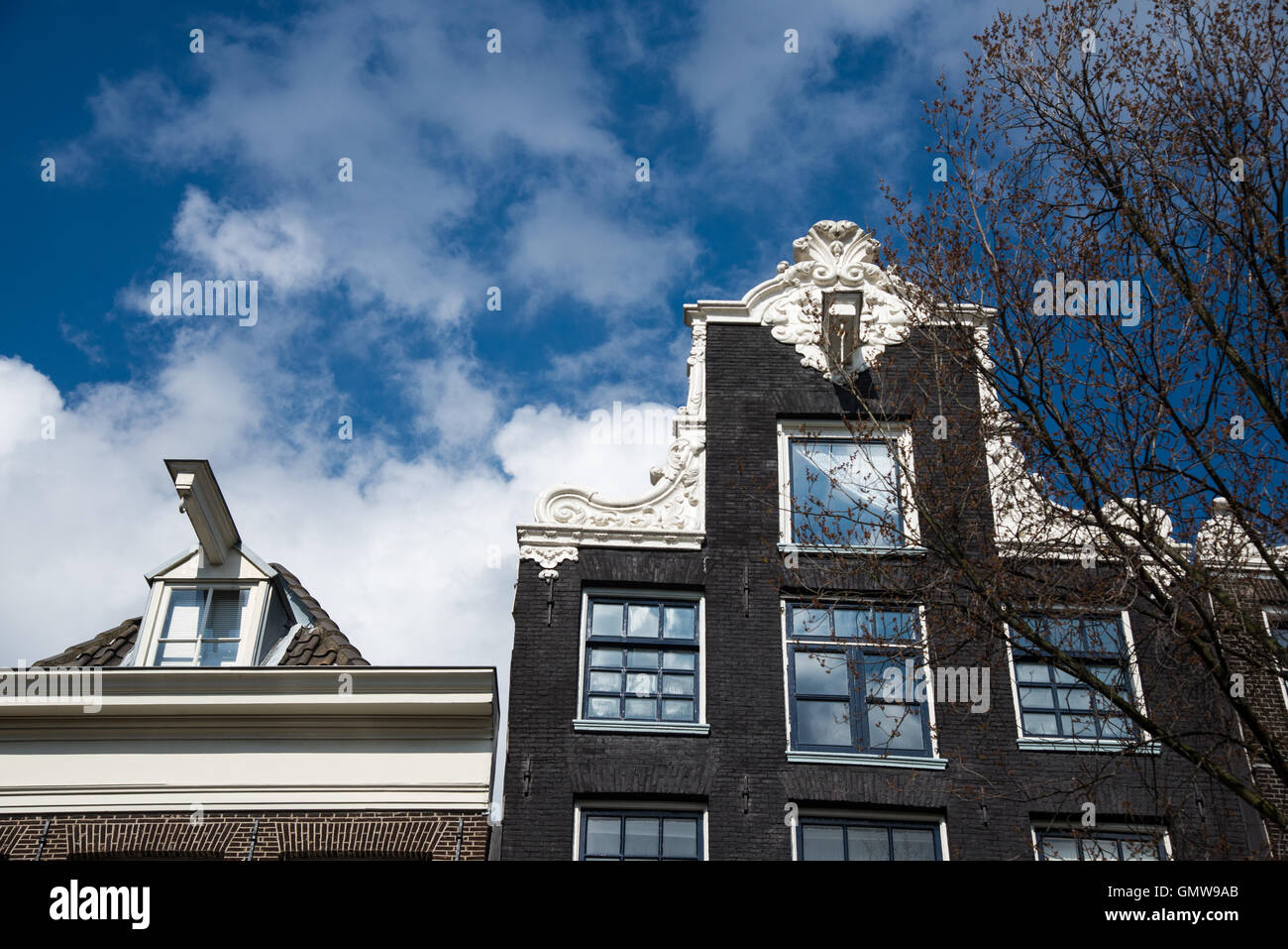 historic buildings at canal in amsterdam holland Stock Photo