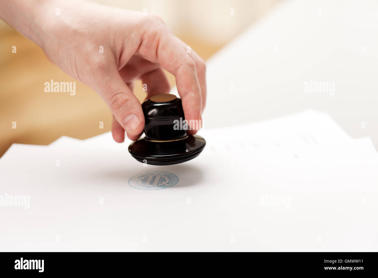 Hand stamp paper document Stock Photo - Alamy
