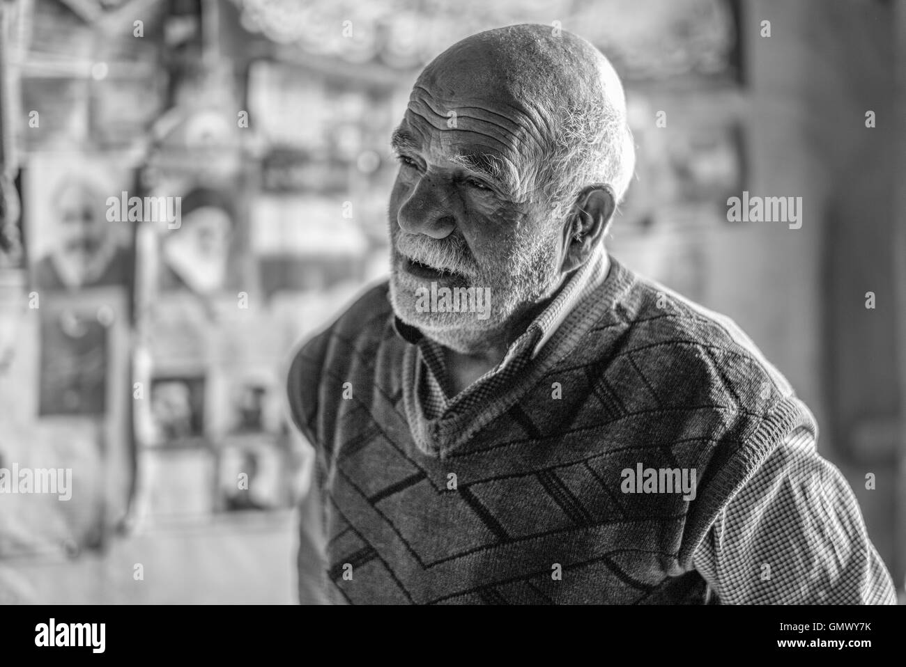 Mohammed Mehdi Mohhebi , oil processing shop owner in Isfahan, Iran, welcomes visitors to his ancient shop. Stock Photo