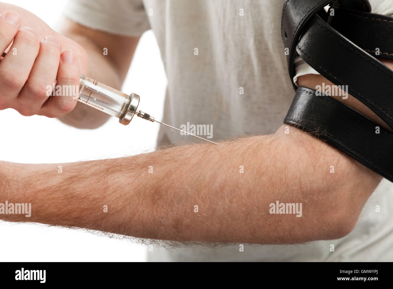Addict injecting syringe Stock Photo