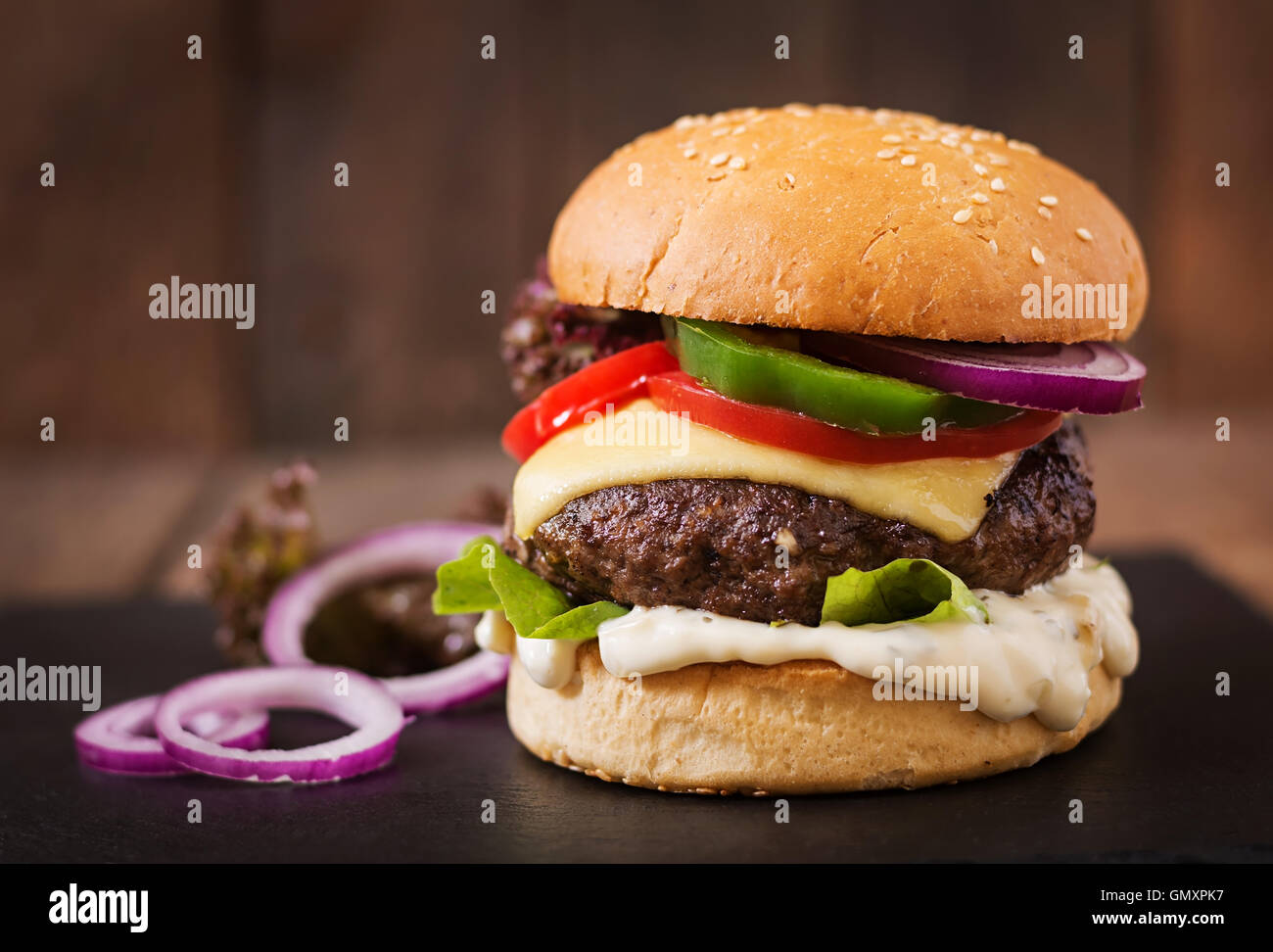 Big sandwich - hamburger burger with beef, cheese, tomato and tartar ...