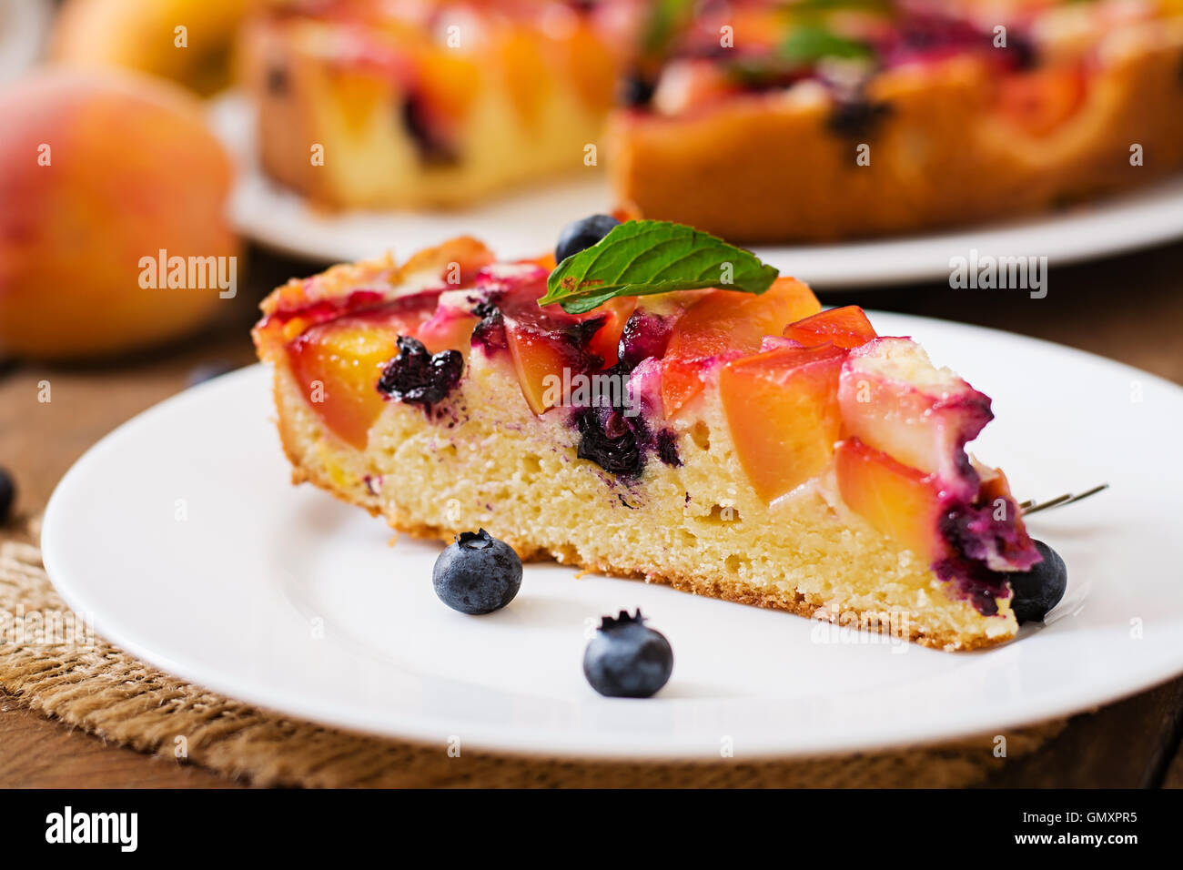 Delicate biscuit pie with peaches and blueberries Stock Photo Alamy
