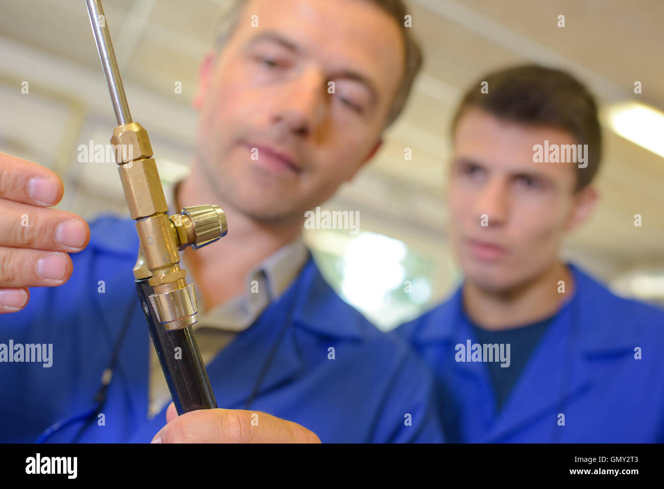 Man adjusting gas burner Stock Photo Alamy
