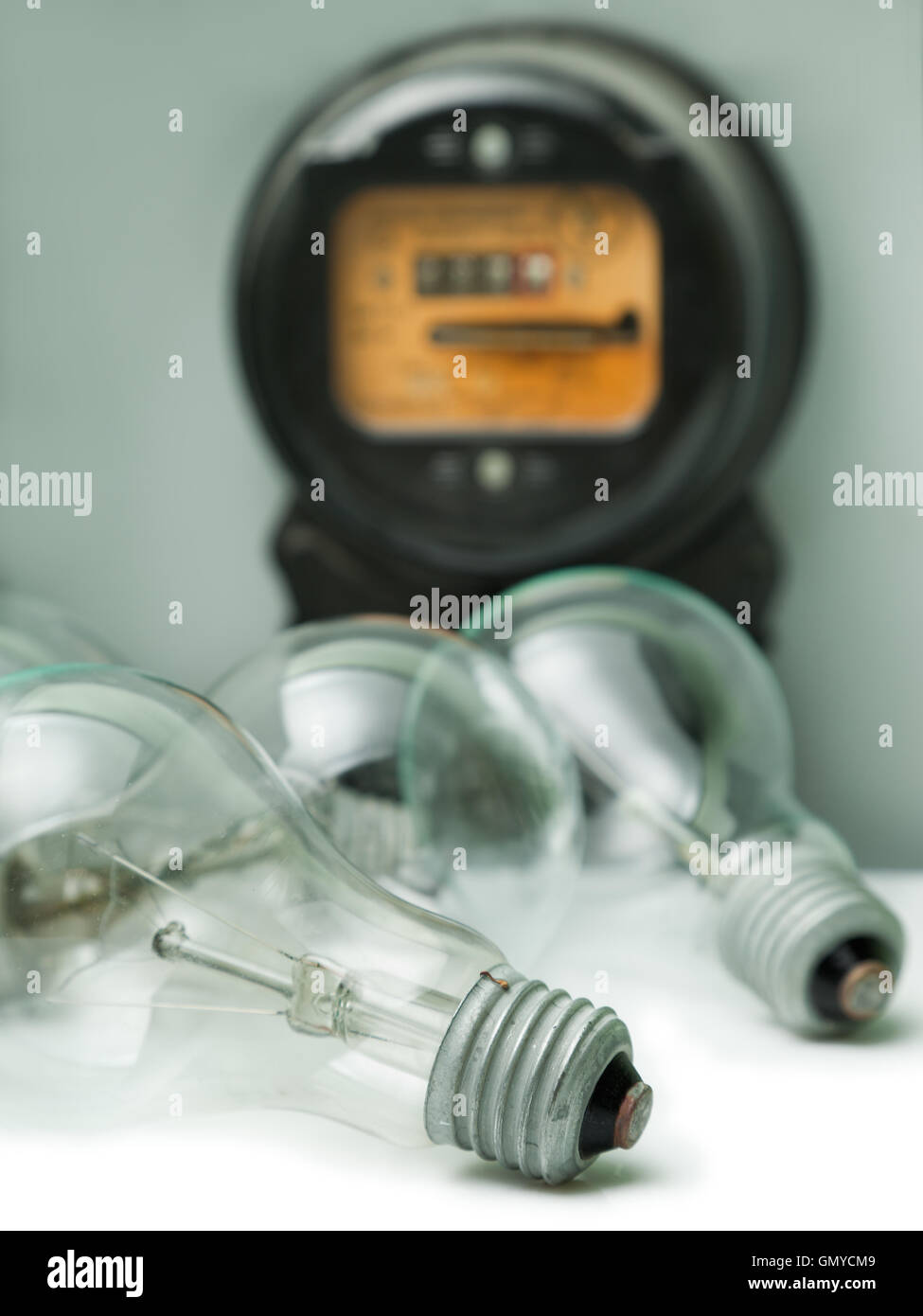 Lamp bulb and electricity supply meter Stock Photo Alamy