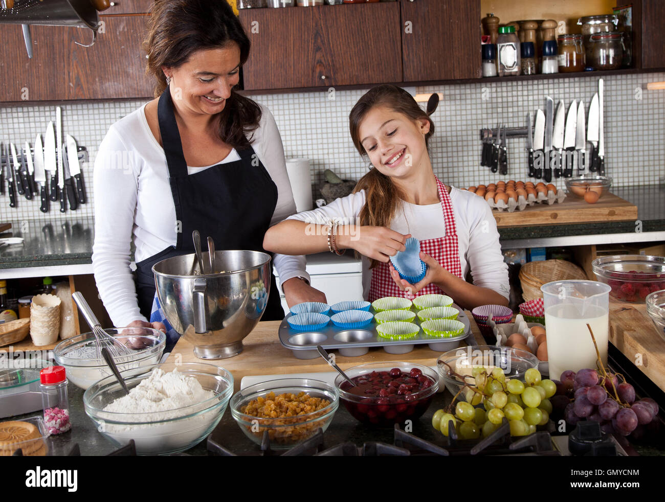 Mother and daughter baking at home Stock Photo Alamy