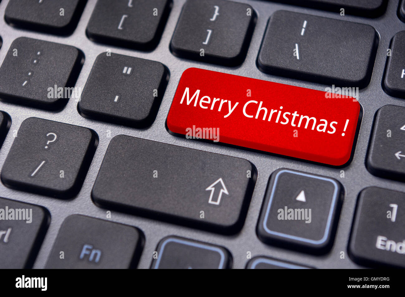 merry christmas greetings on keyboard enter key Stock Photo