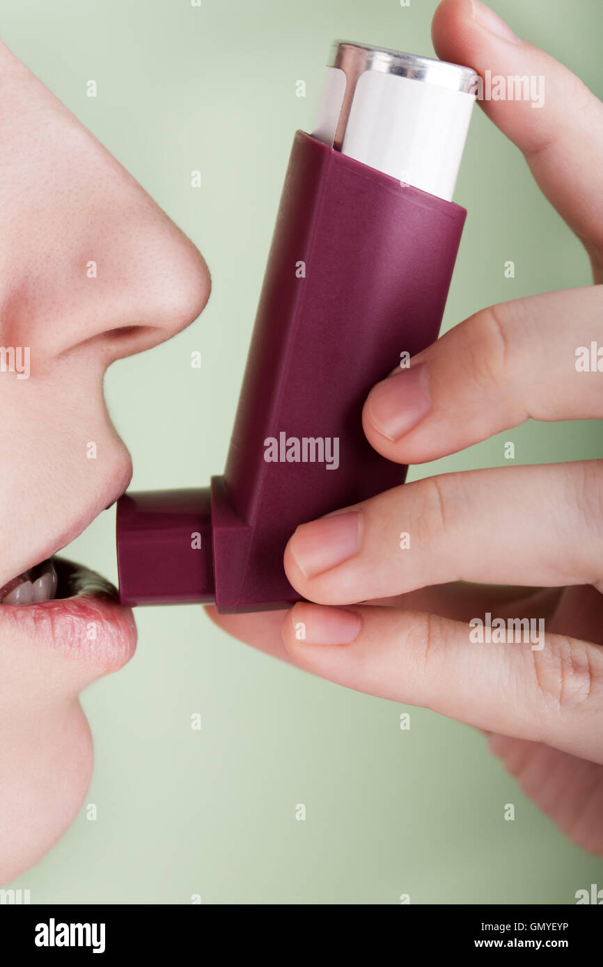 Women with asthmatic inhaler Stock Photo Alamy