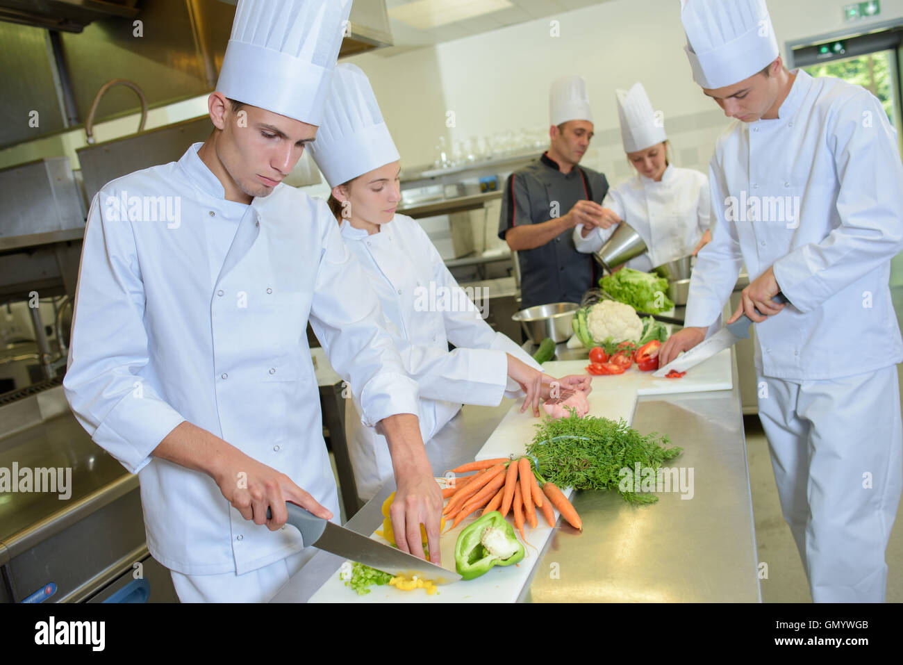 Team of chefs preparing vegetables Stock Photo - Alamy