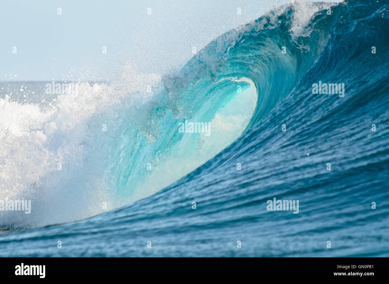 A big barrel wave break in the Pacific Ocean, perfect for surfing. Stock Photo
