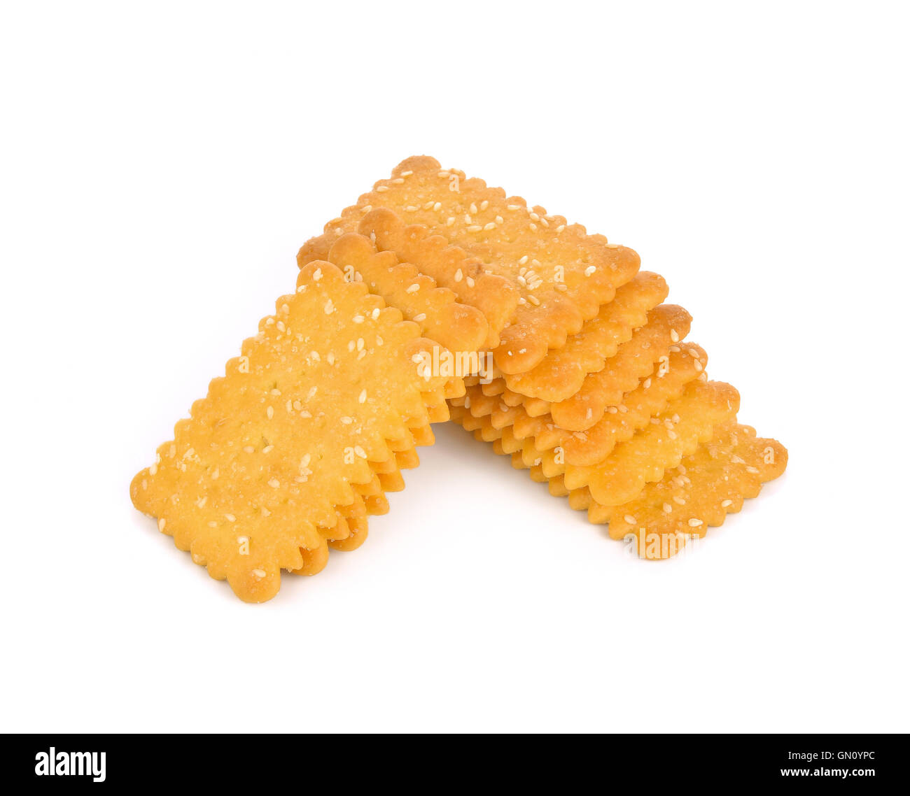 Cookies crackers biscuits sprinkled with sesame on a white background
