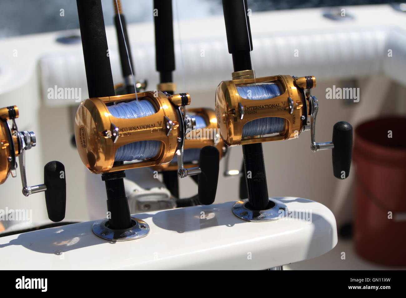 Picture of fishing rods and reels on a boat that is offshore fishing for  marlin and other billfish on the ocean on a sunny day in Costa Rica Stock  Photo - Alamy